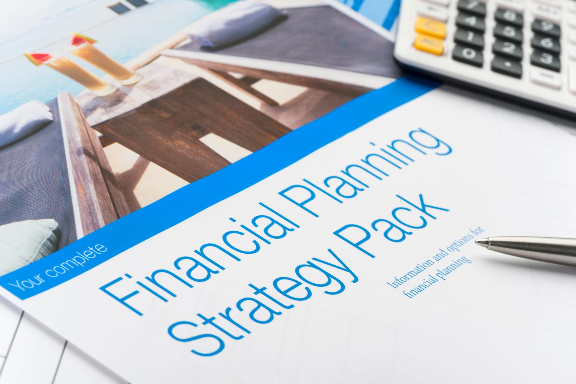 Close up of a financial planning document with calculator.