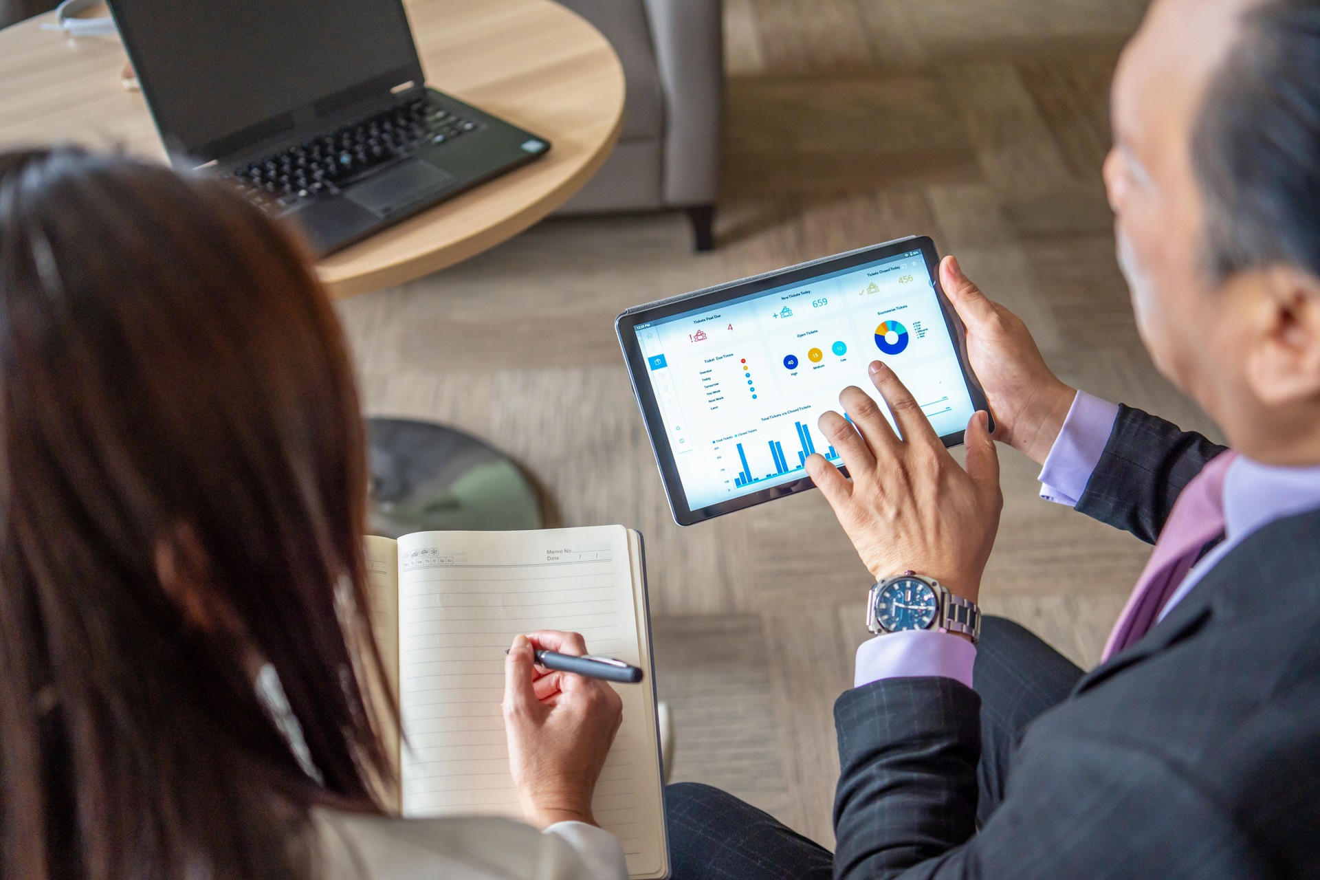 business people showing inforgraphic digital tablet